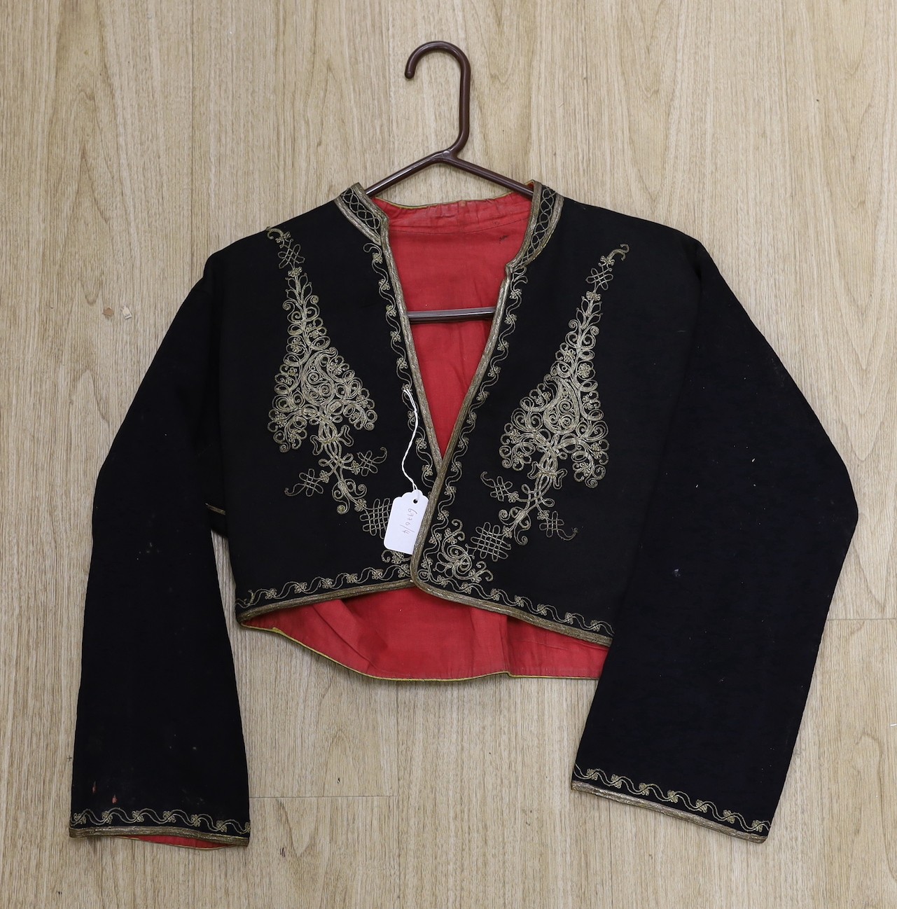 A 19th century gents short black wool jacket, embroidered in gold coloured thread